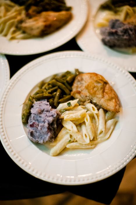 Plated dinner of chicken, pasta and green beans