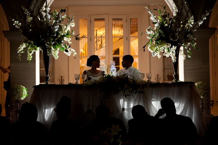 Guests seated at the head table in the evening