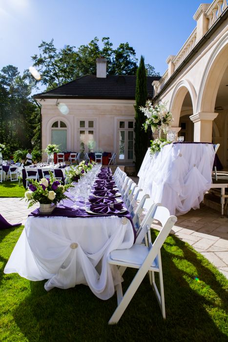 Long banquet table on the lawn beside the venue
