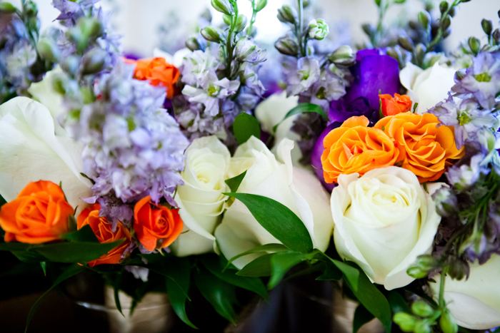 Close-up of white roses, orange roses and lavender stock